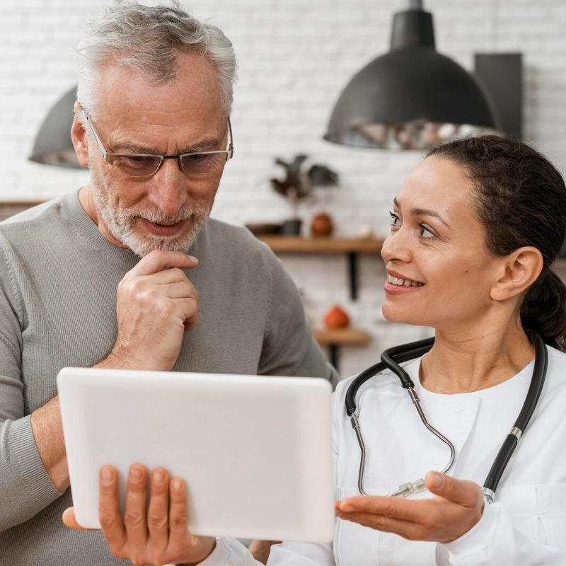 doctor-posing-with-her-patient_23-2148813415