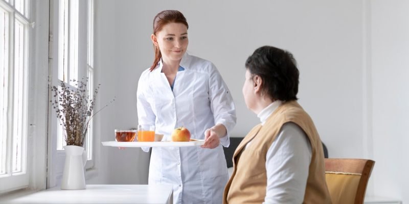 medium-shot-woman-holding-food-tray_23-2148940043